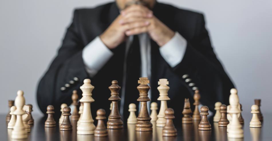 a man playing chess, strategy